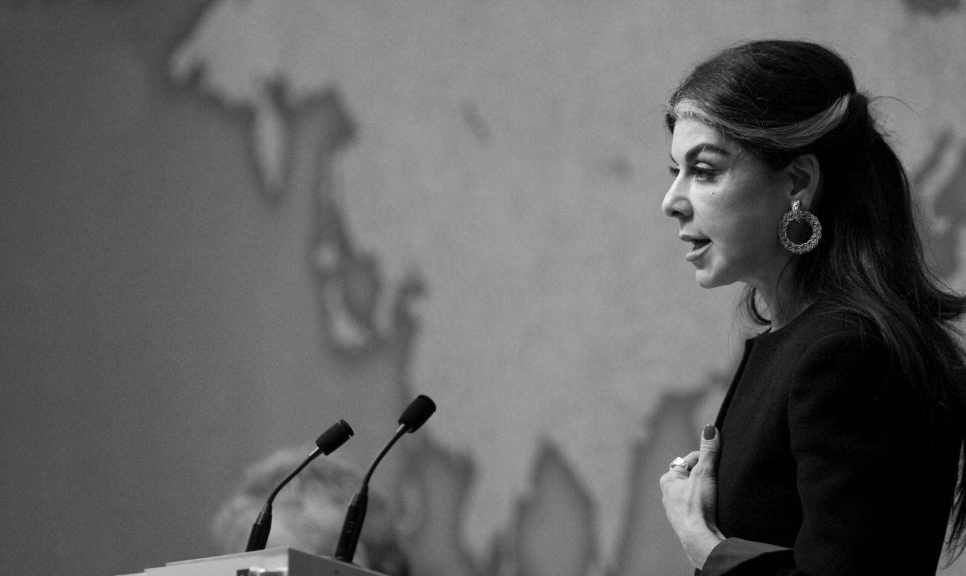 Black and white image of Dr Yamani speaking at event